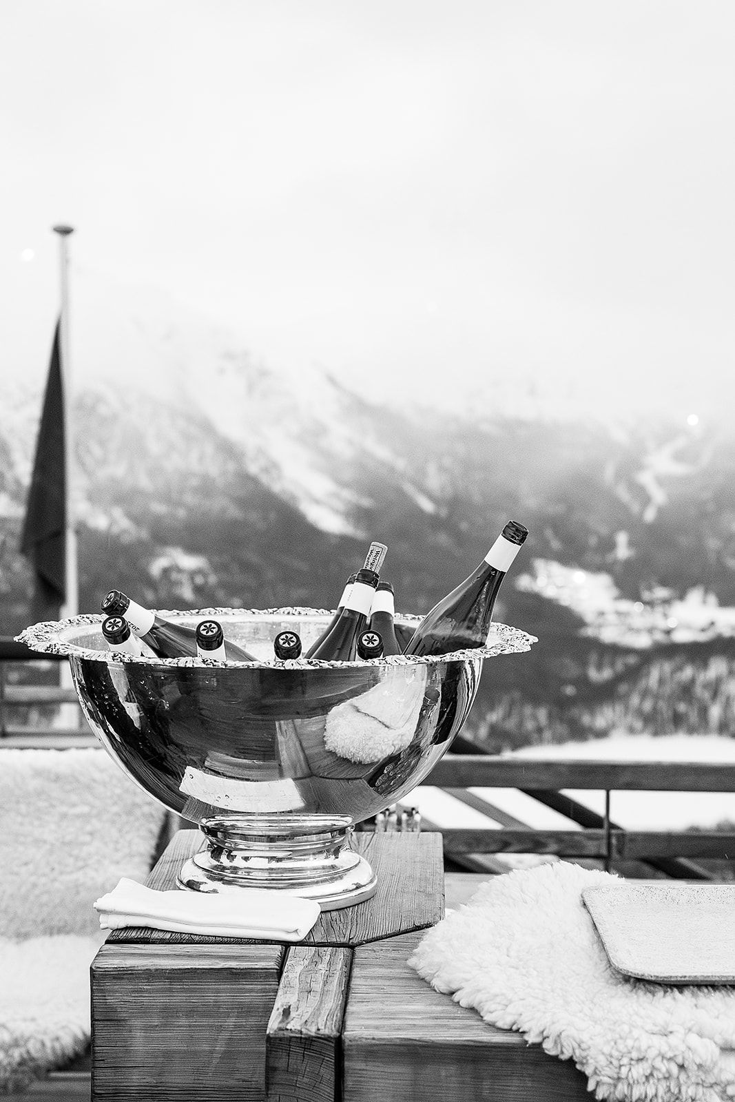 Bottles with mountain view at the welcome dinner of old world winter wedding in Saint Moritz