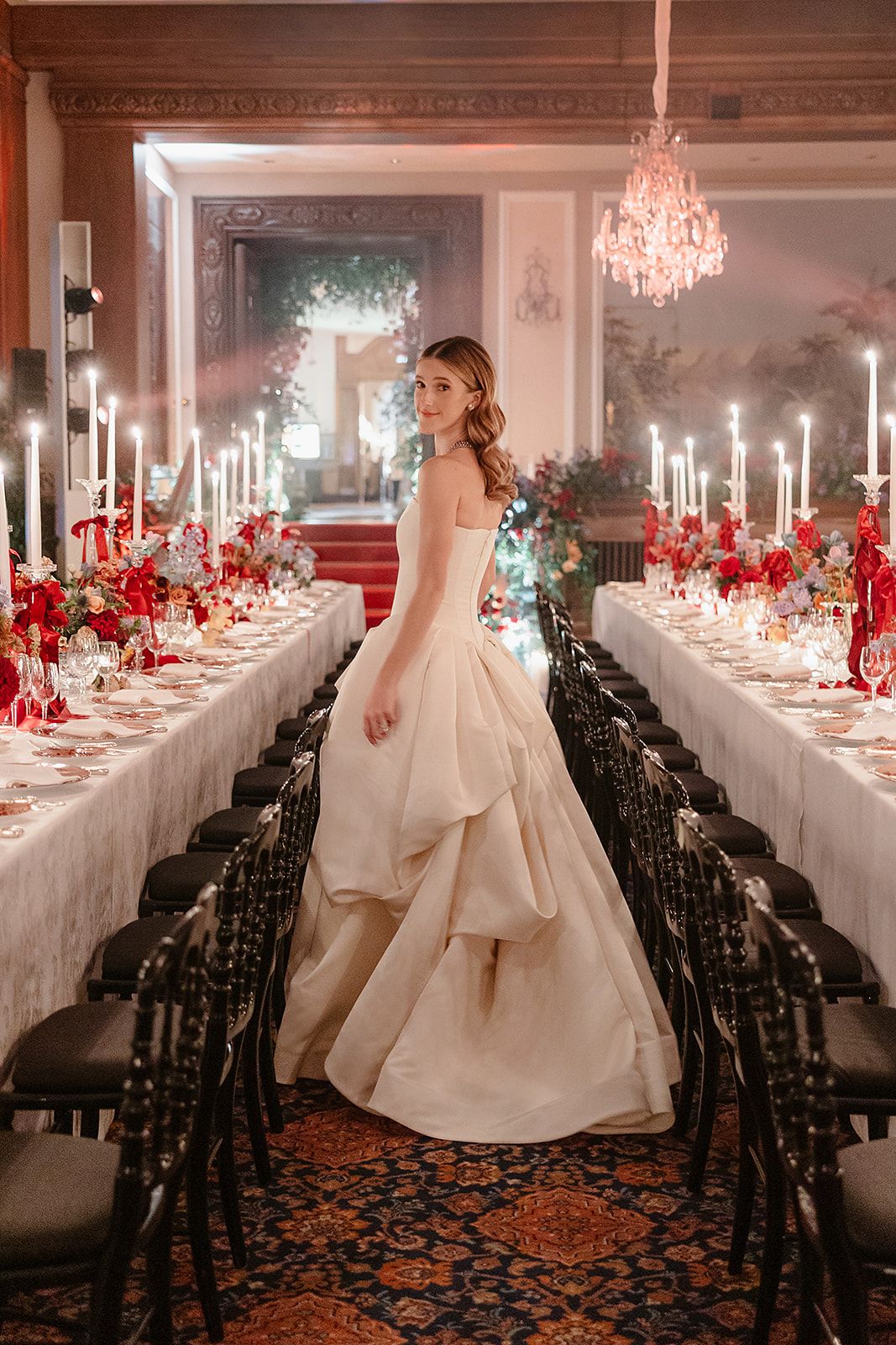 Bride between tables at the old world winter wedding in Saint Moritz