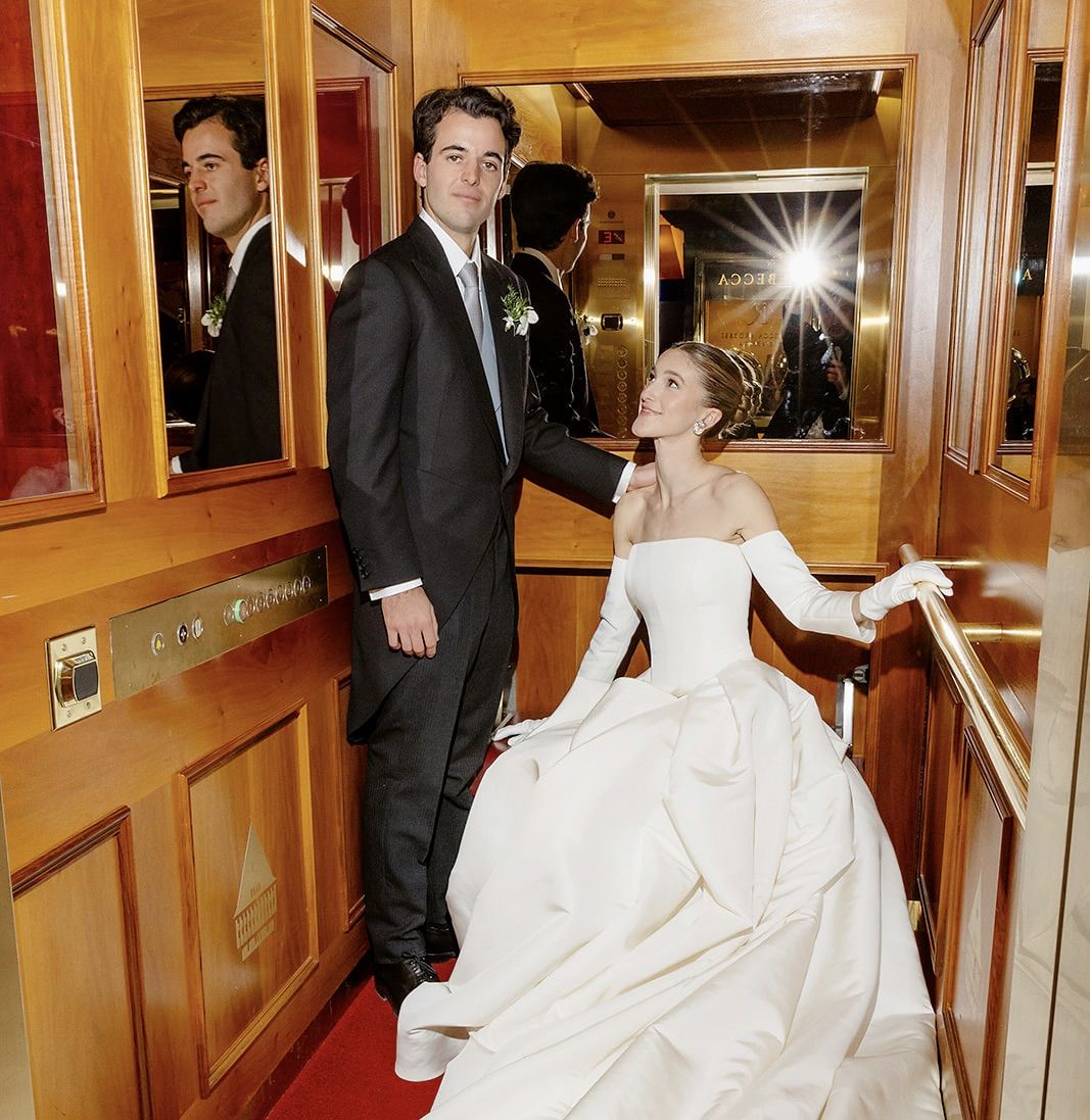 Bride and groom on the lift at the old world winter wedding in Saint Moritz