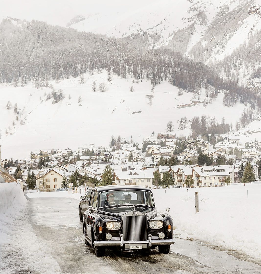 Bride on the Bentley at the old world winter wedding in Saint Moritz