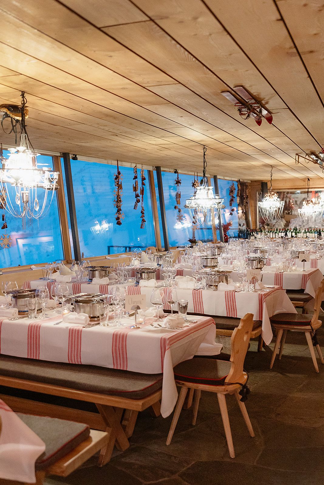 Dinner tables at the welcome dinner of old world winter wedding in Saint Moritz