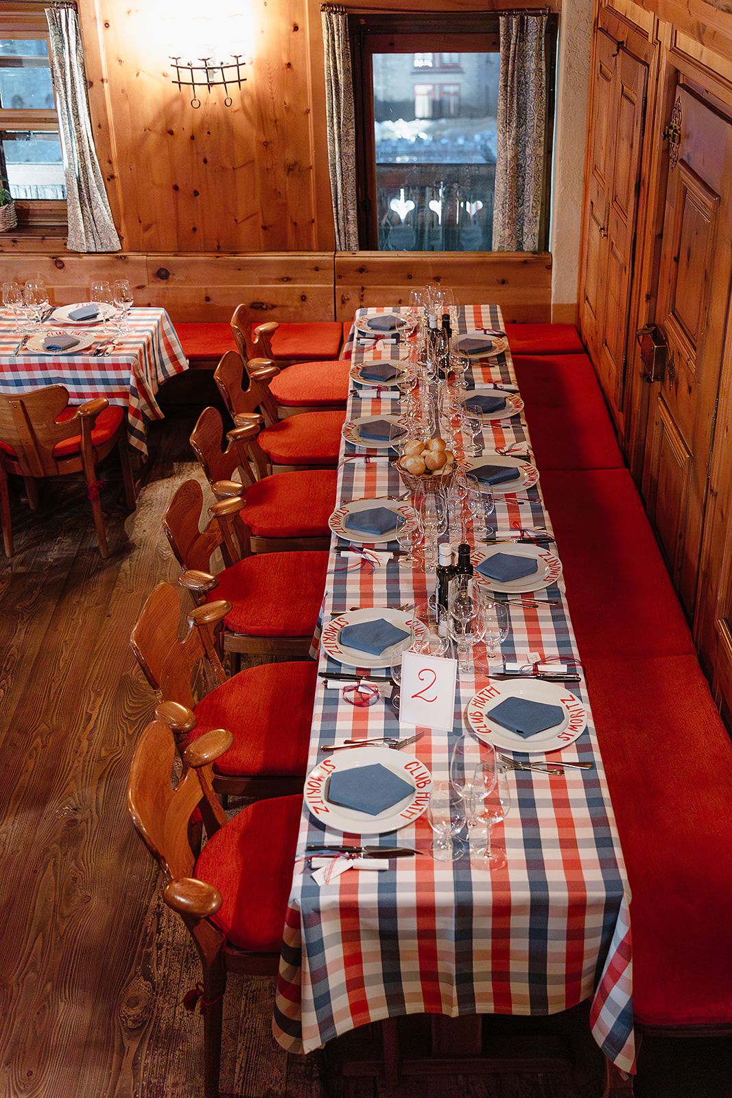 Long tables at the rehearsal dinner of old world winter wedding in Saint Moritz