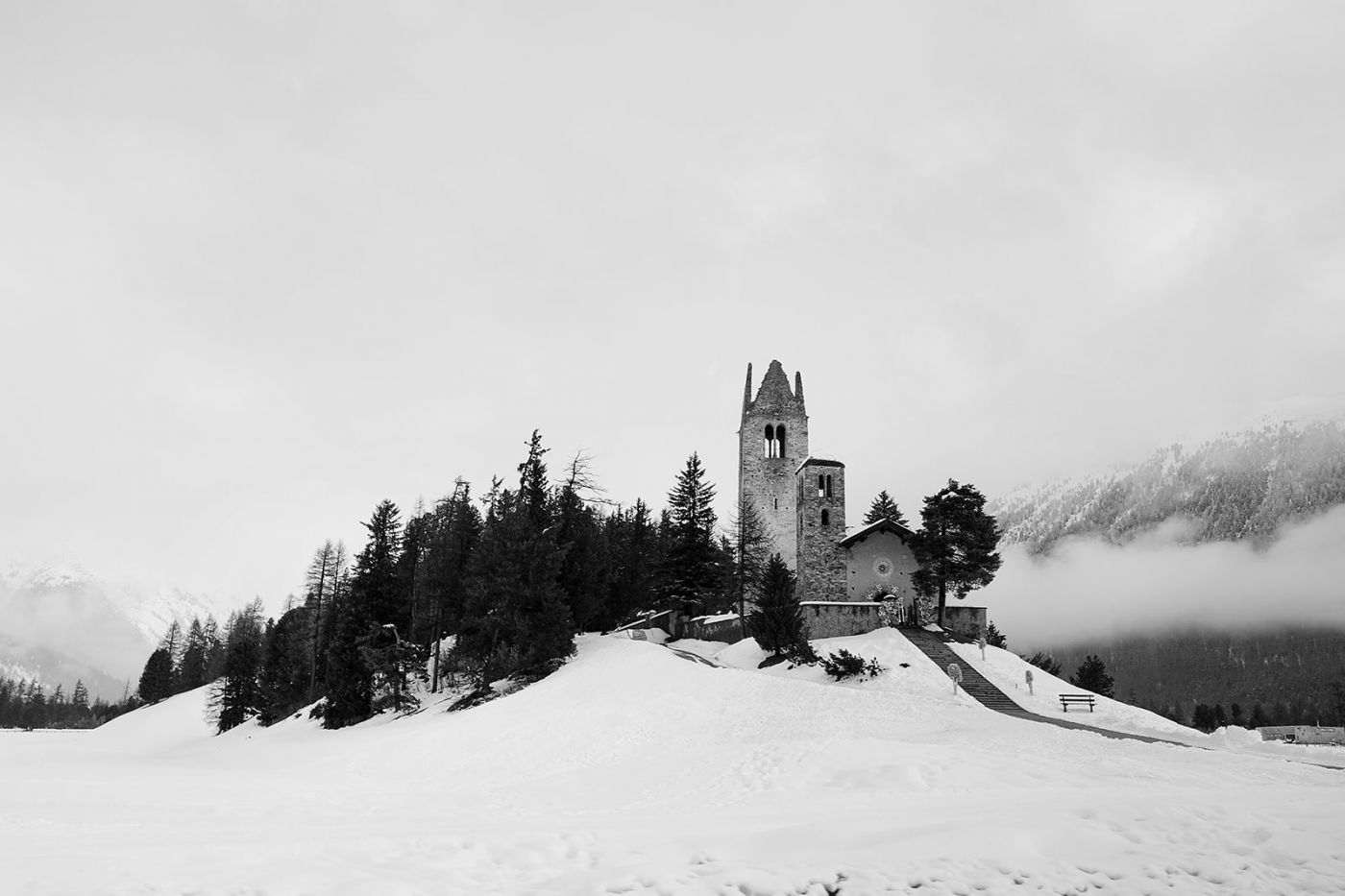 View of the church at the old world winter wedding in Saint Moritz